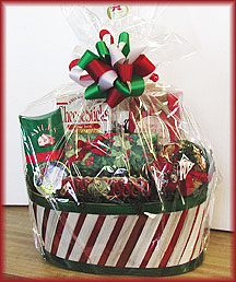 CANDY STRIPES ANYONE? - Candy stripe basket loaded with holiday snacks including cheese sticks, triple chocolate chip cookies, mulling spices, our delicious hand dipped chocolates, jumbo salted cashews, Hammond's famous ribbon candy and holiday Bon Bons.