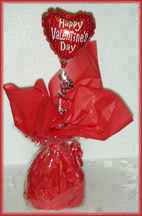 Assorted Valentine candies with mini Valentines Balloon. Inexpensive but cute!