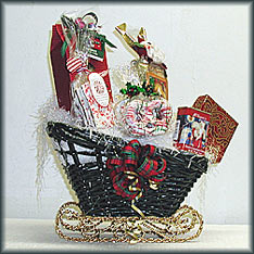 Santa's Holiday Sleigh - Christmas box of nuts, peppermint bark, double chocolate cocoa, Santa snack mix, Godiva chocolates and Christmas pretzels.